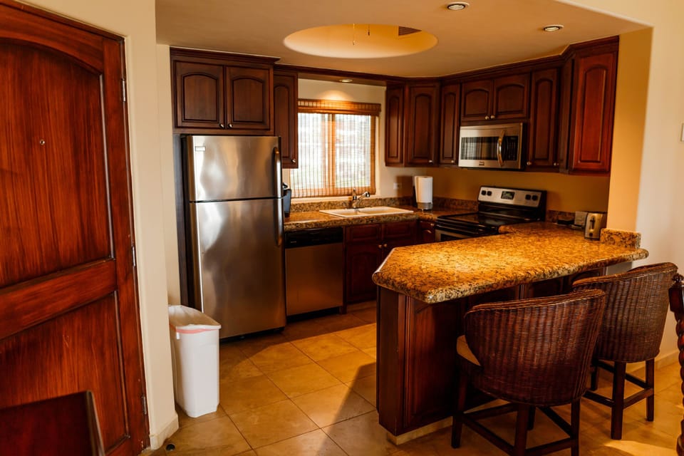 Condo, 2 Bedrooms | Private kitchen | Oven, stovetop, toaster, cookware/dishes/utensils