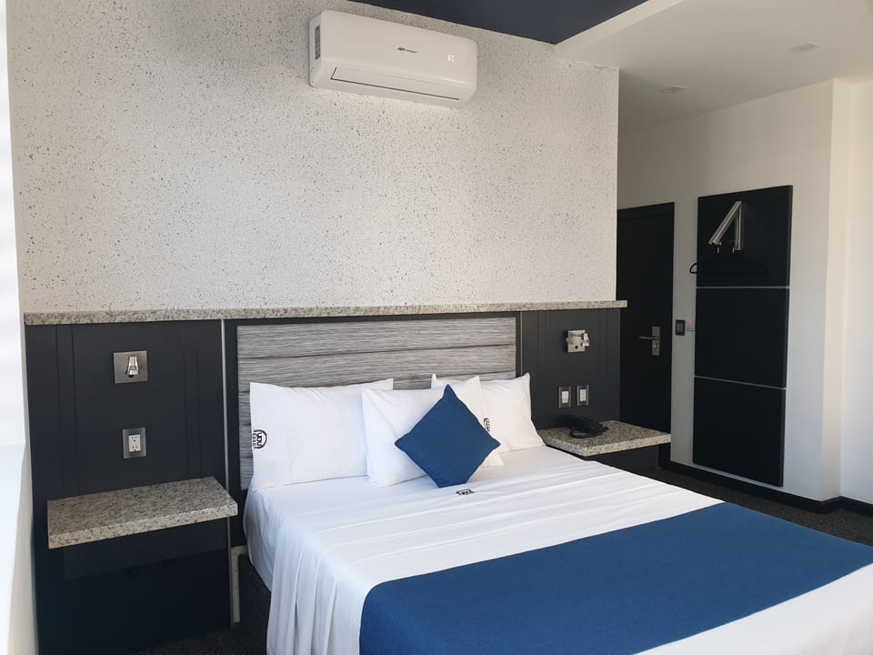 Deluxe Room, 1 Queen Bed | Premium bedding, memory foam beds, laptop workspace, iron/ironing board