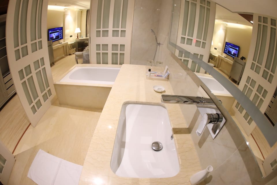 Queen Suite | Bathroom | Rainfall showerhead, free toiletries, hair dryer, bathrobes