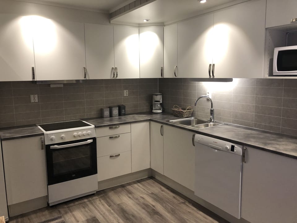Standard Apartment, 4 Bedrooms (Rorbu Båtsfjord) | Private kitchen | Coffee/tea maker, microwave (on request), electric kettle