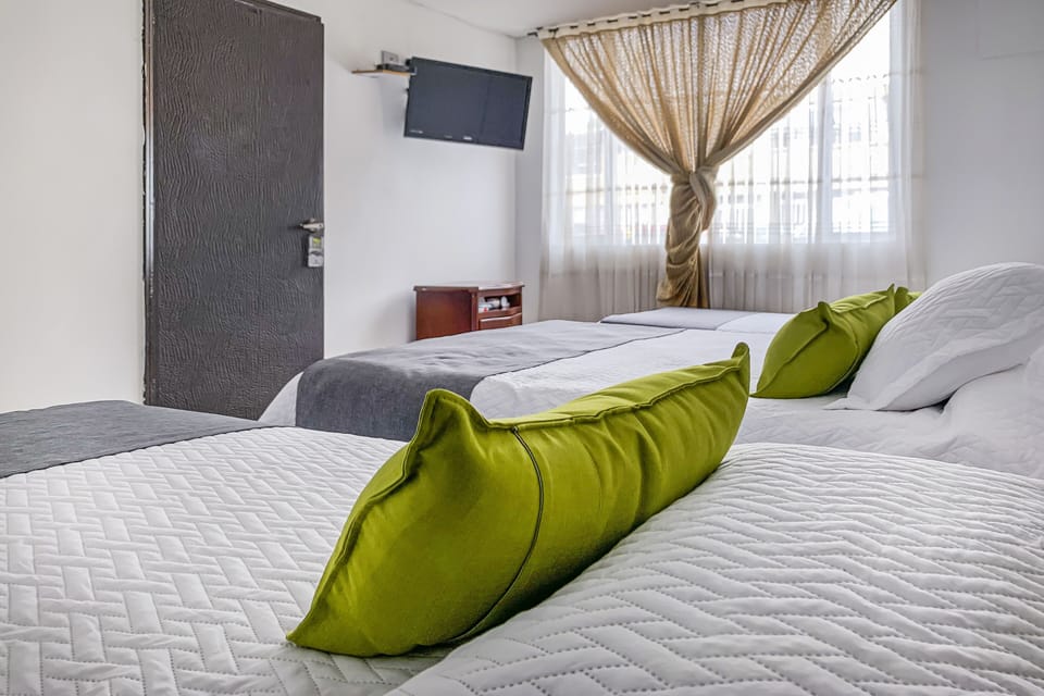 Standard Quadruple Room | Desk, blackout drapes, free WiFi, bed sheets
