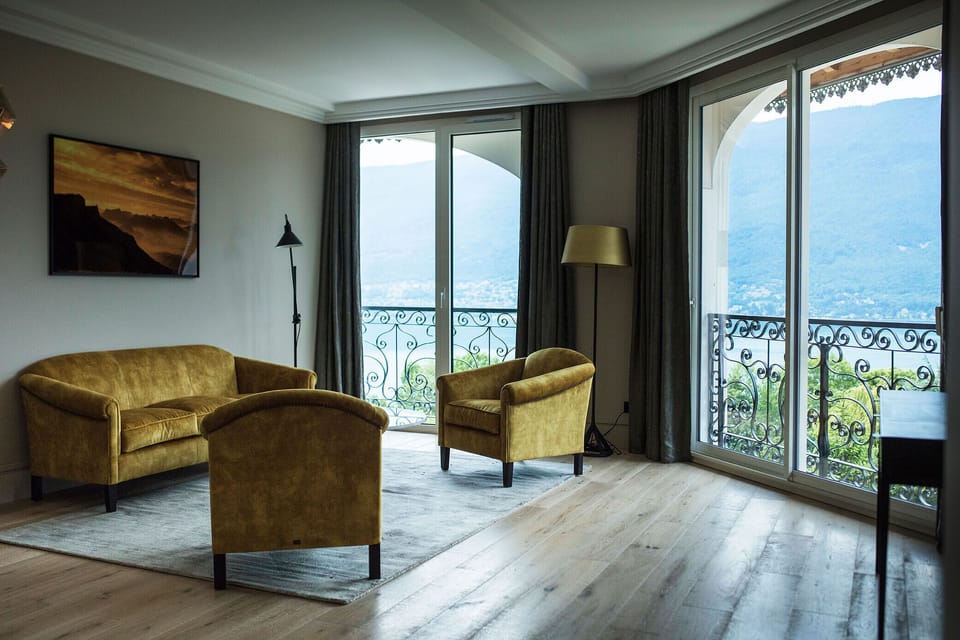 Junior Suite, Lake View | Living area | Flat-screen TV