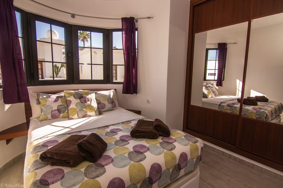1 bedroom, blackout drapes, iron/ironing board, cribs (free)