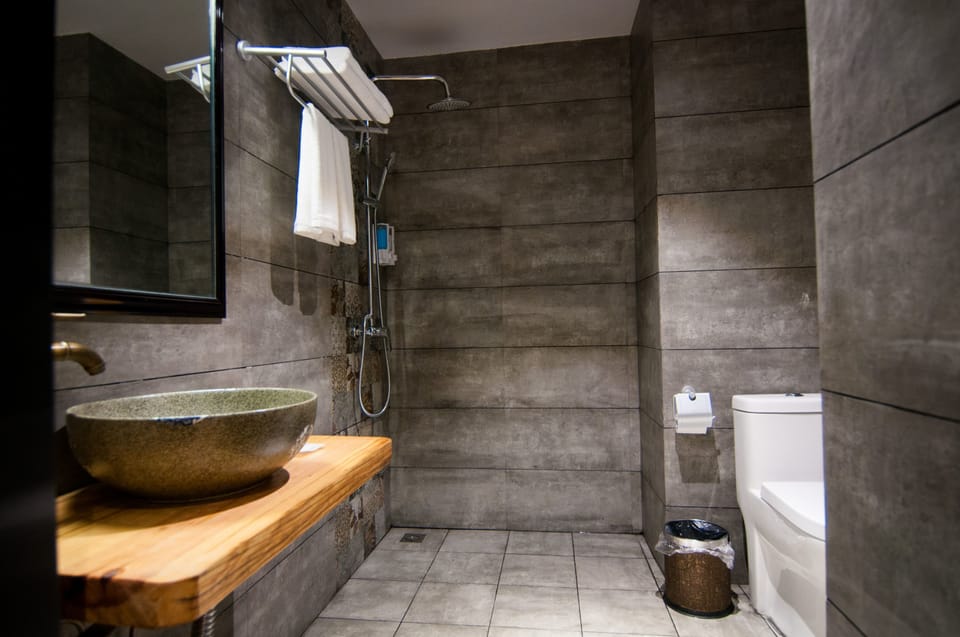 Shower, free toiletries, hair dryer, slippers
