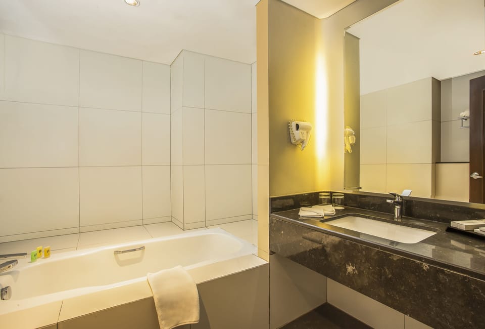 Suite | Bathroom | Hair dryer, slippers, bidet, towels