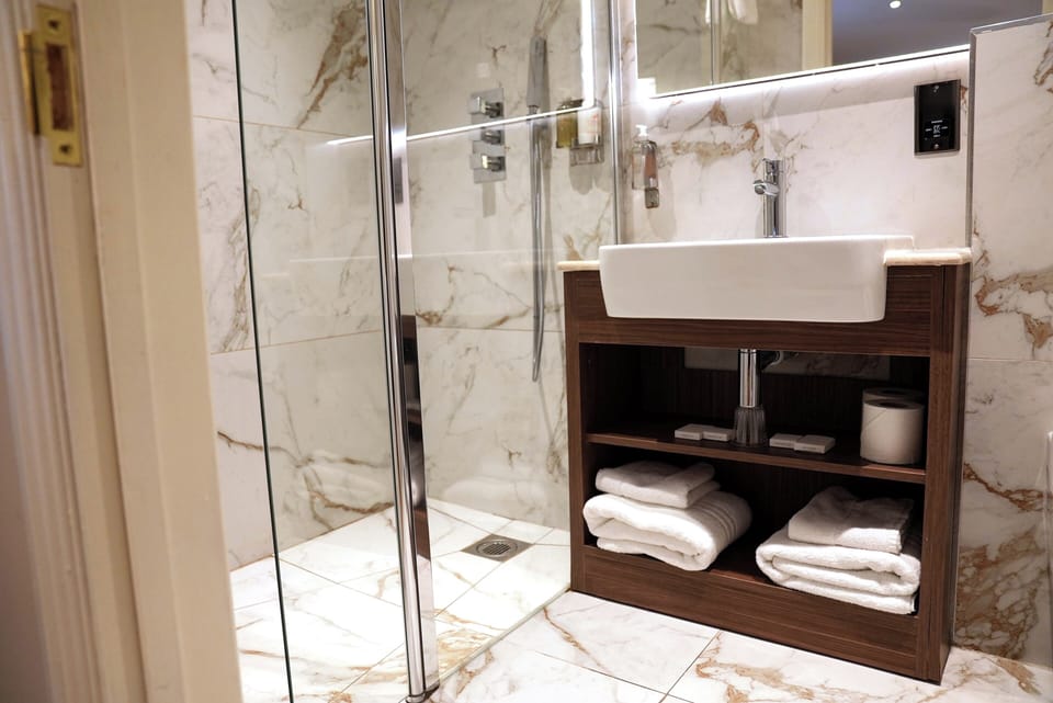 Executive Triple Room | Bathroom | Shower, hair dryer, towels, soap
