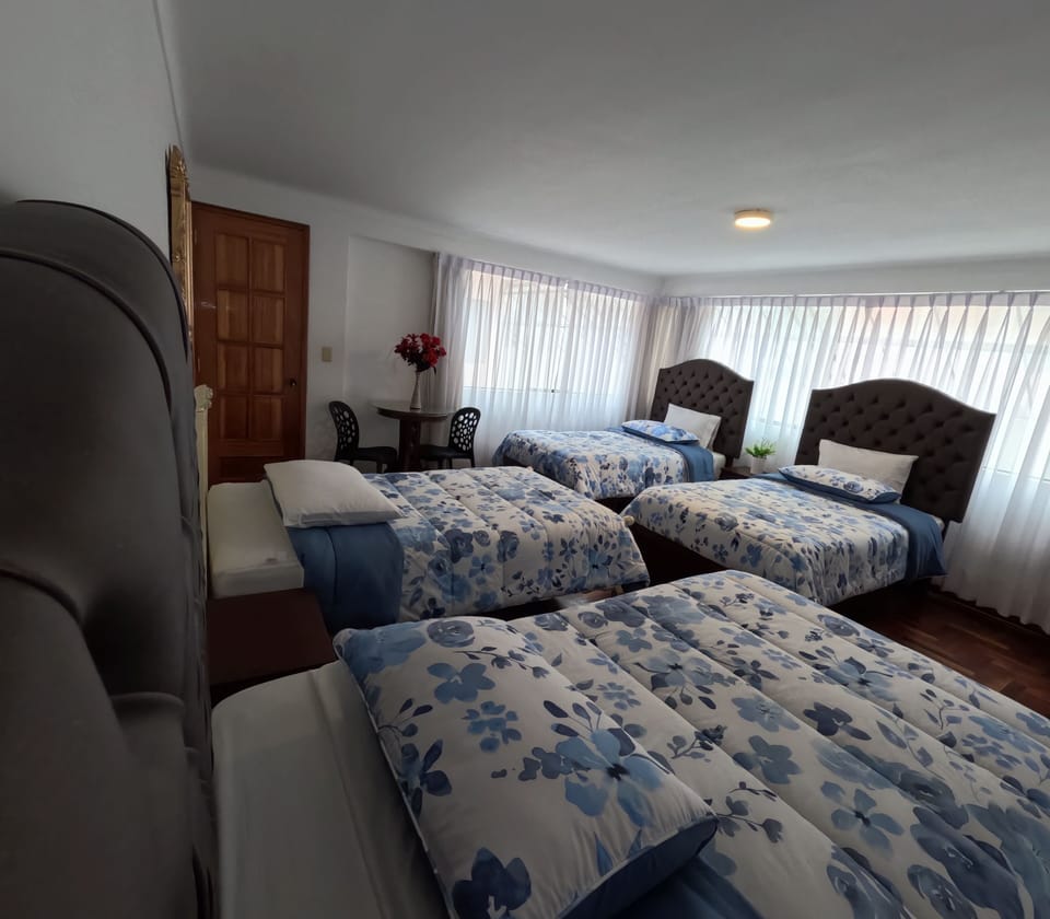Family Quadruple Room, Courtyard View | Minibar, individually decorated, individually furnished