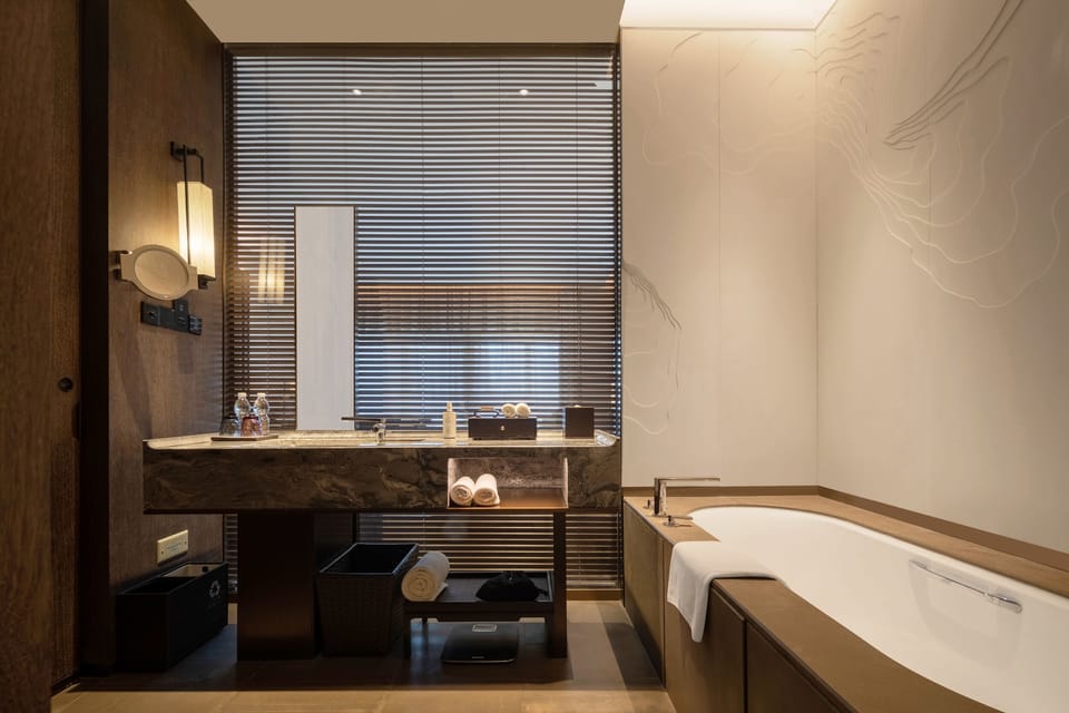 Separate tub and shower, rainfall showerhead, hair dryer, bathrobes