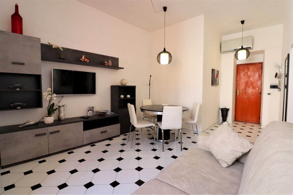 Apartment, 1 Bedroom, Balcony, Beachside | Living room | Flat-screen TV
