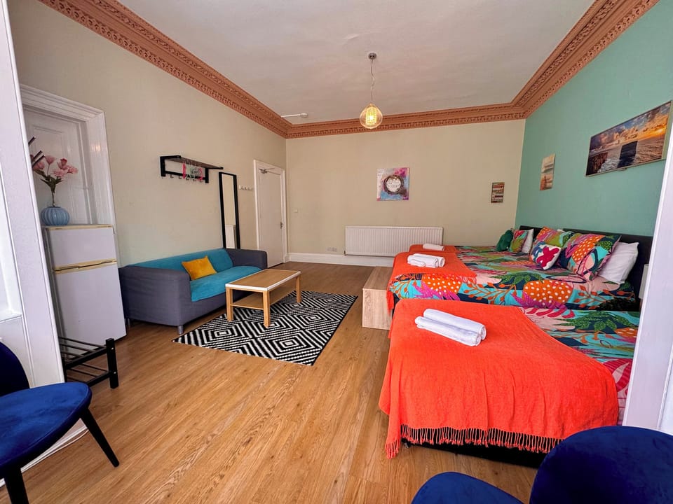 Quadruple Room, Shared Bathroom (Room 1) | Blackout drapes, iron/ironing board, free WiFi, bed sheets