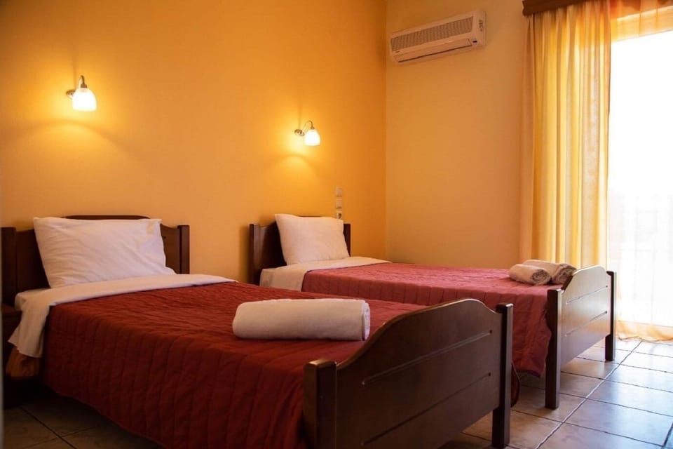 Economy Double or Twin Room, Partial Sea View | Laptop workspace, blackout drapes, free WiFi, bed sheets