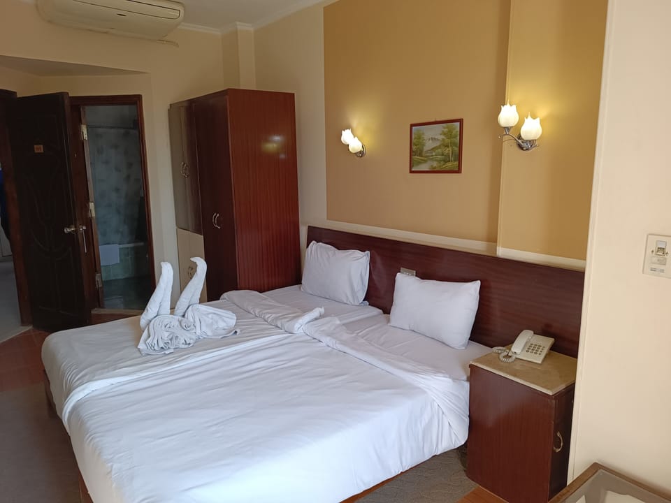 Single Room, City View | 1 bedroom, premium bedding, minibar, in-room safe