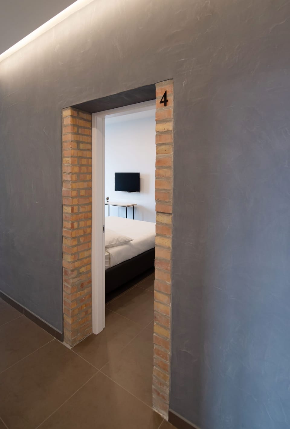 Deluxe Quadruple Room, City View | Premium bedding, desk, laptop workspace, soundproofing