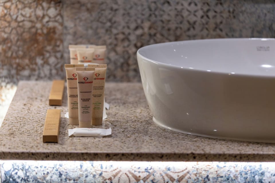 Standard Suite, 1 King Bed | Bathroom amenities | Free toiletries, hair dryer, towels