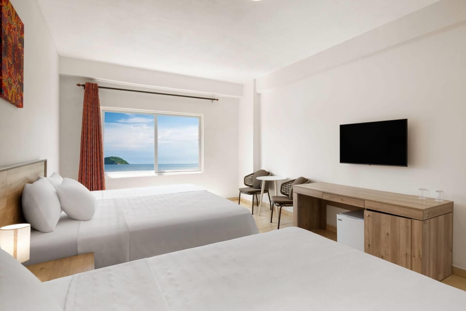 Room, 2 Queen Beds, Ocean View | Premium bedding, in-room safe, laptop workspace, iron/ironing board