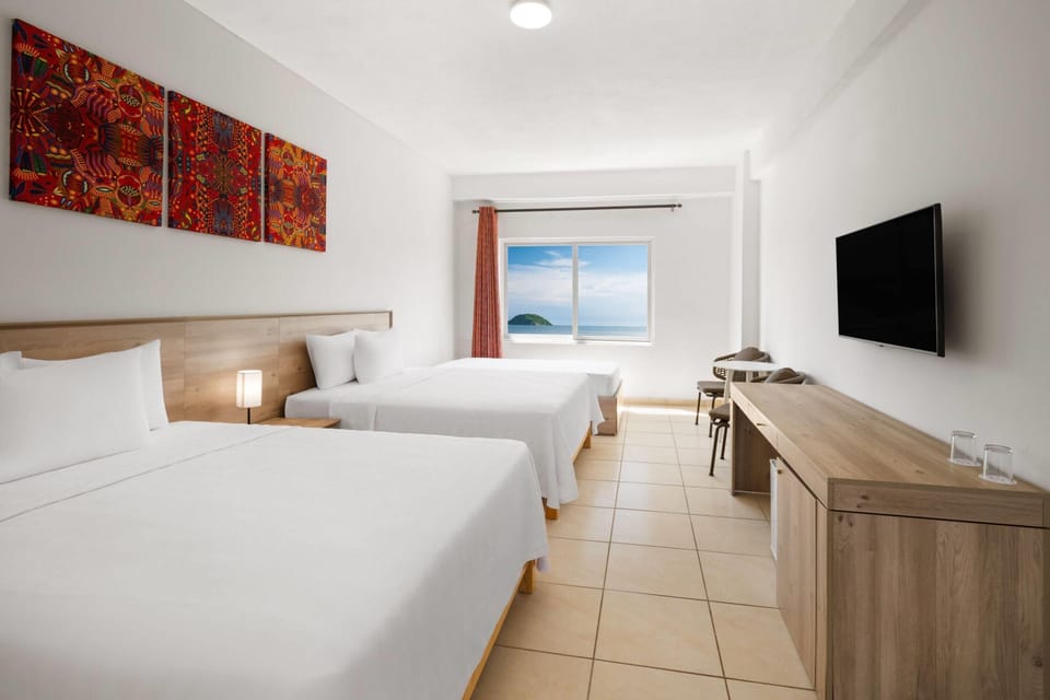 Room, 2 Queen Beds, Ocean View | Premium bedding, in-room safe, laptop workspace, iron/ironing board