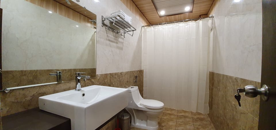 Shower, rainfall showerhead, designer toiletries, hair dryer