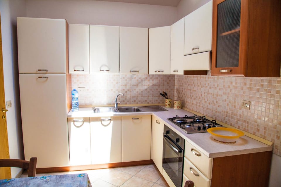 Full-size fridge, oven, stovetop, espresso maker