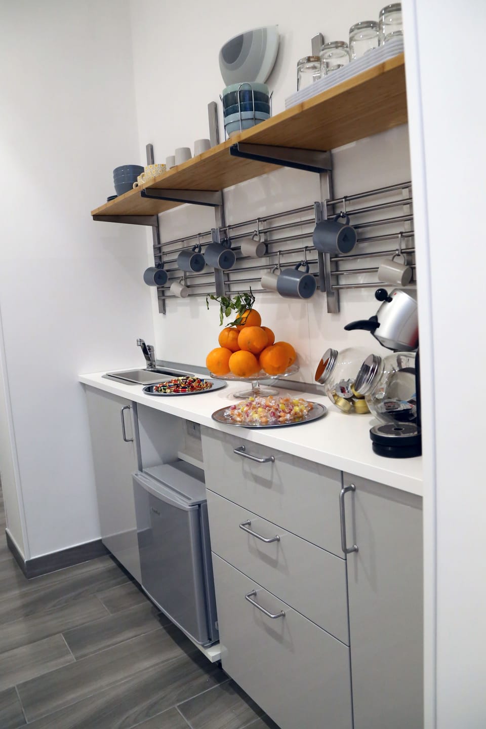 Fridge, espresso maker, coffee/tea maker, cookware/dishes/utensils