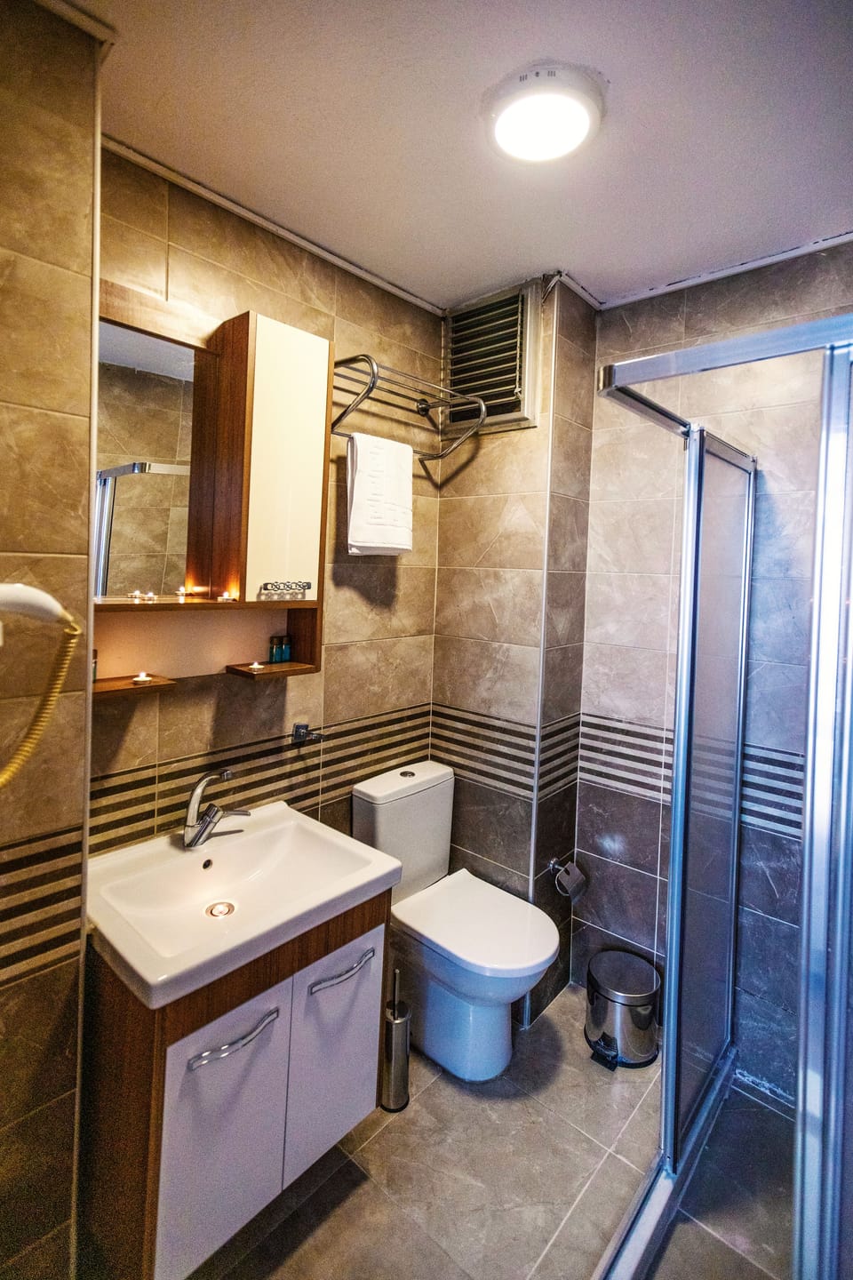 Shower, hair dryer, slippers, towels