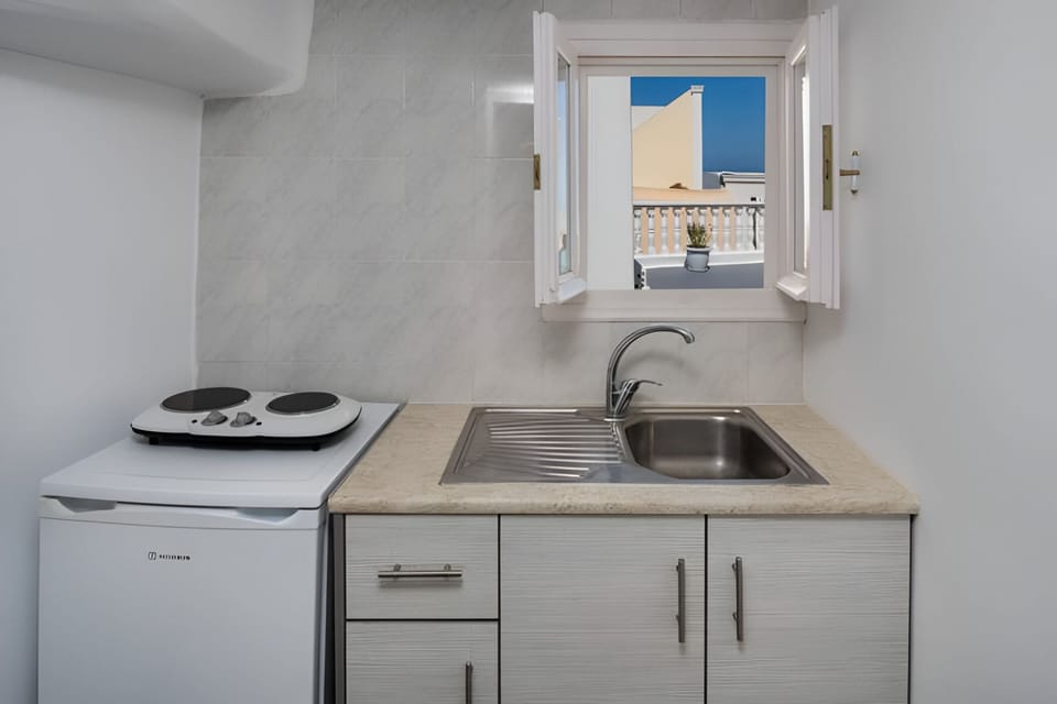 Standard Quadruple Room | Private kitchen | Fridge, electric kettle