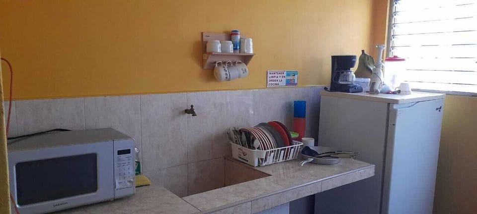 Standard Double Room, Garden View | Shared kitchen | Microwave, coffee/tea maker, cookware/dishes/utensils