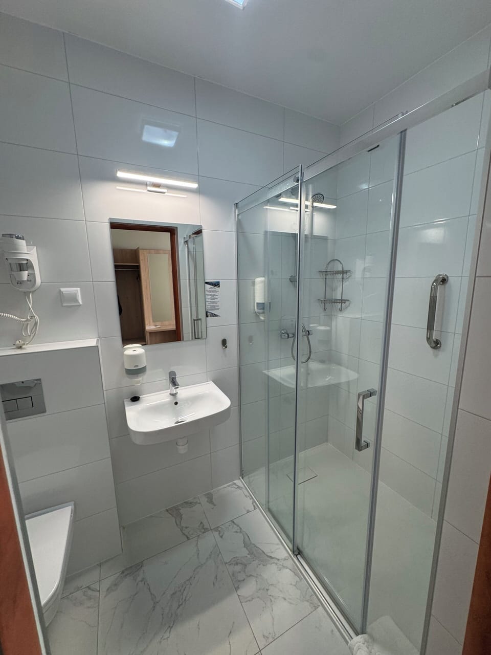 Shower, hair dryer, towels, soap