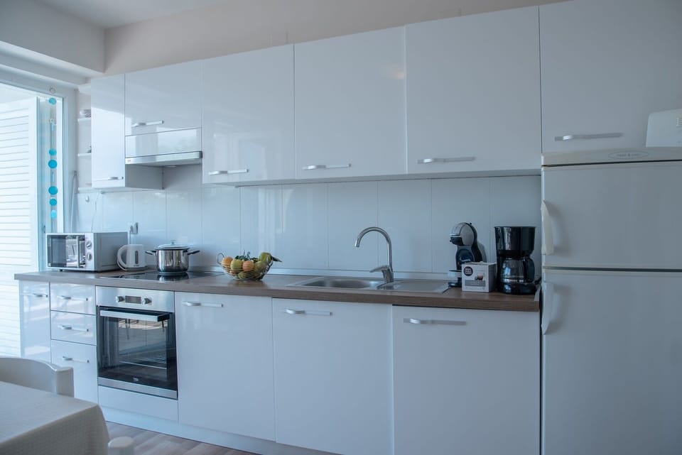 Apartment, Sea View | Private kitchen | Fridge, microwave, oven, stovetop