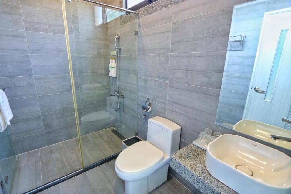 Garden View Quadruple Room | Bathroom | Hair dryer, slippers, towels, shampoo