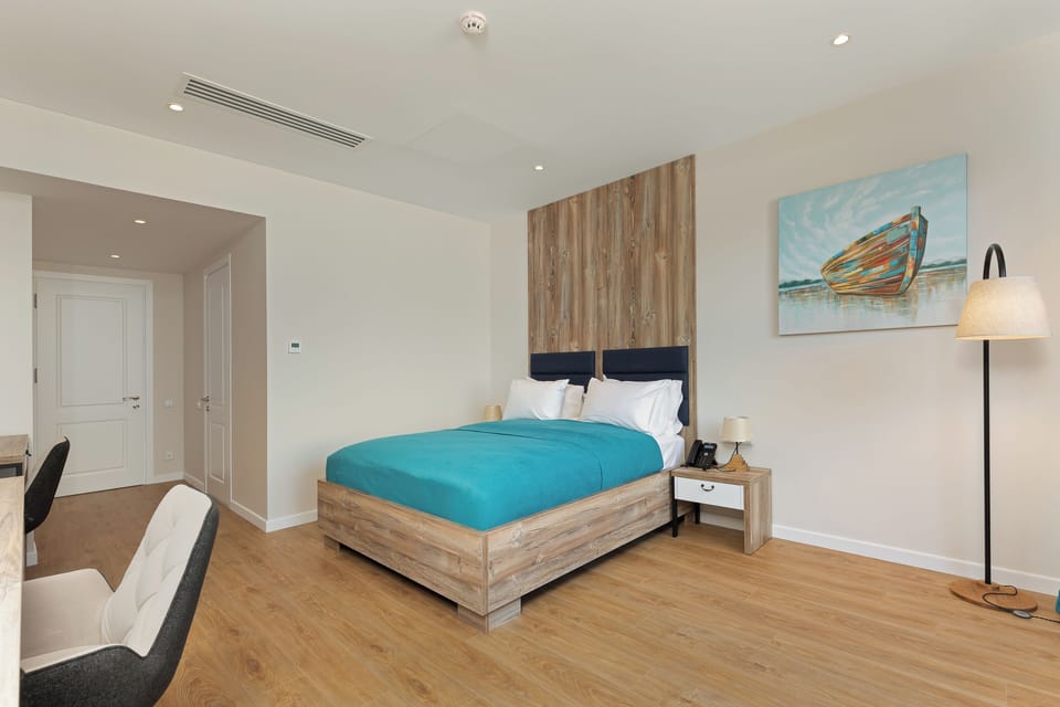 Junior Suite With Terrace | Minibar, in-room safe, desk, laptop workspace