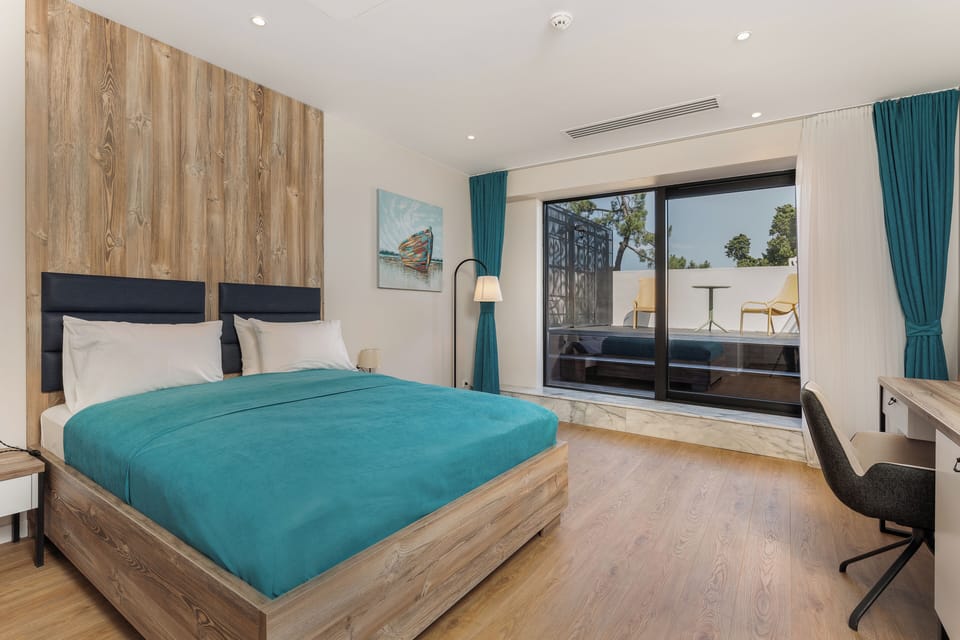 Junior Suite With Terrace | Minibar, in-room safe, desk, laptop workspace