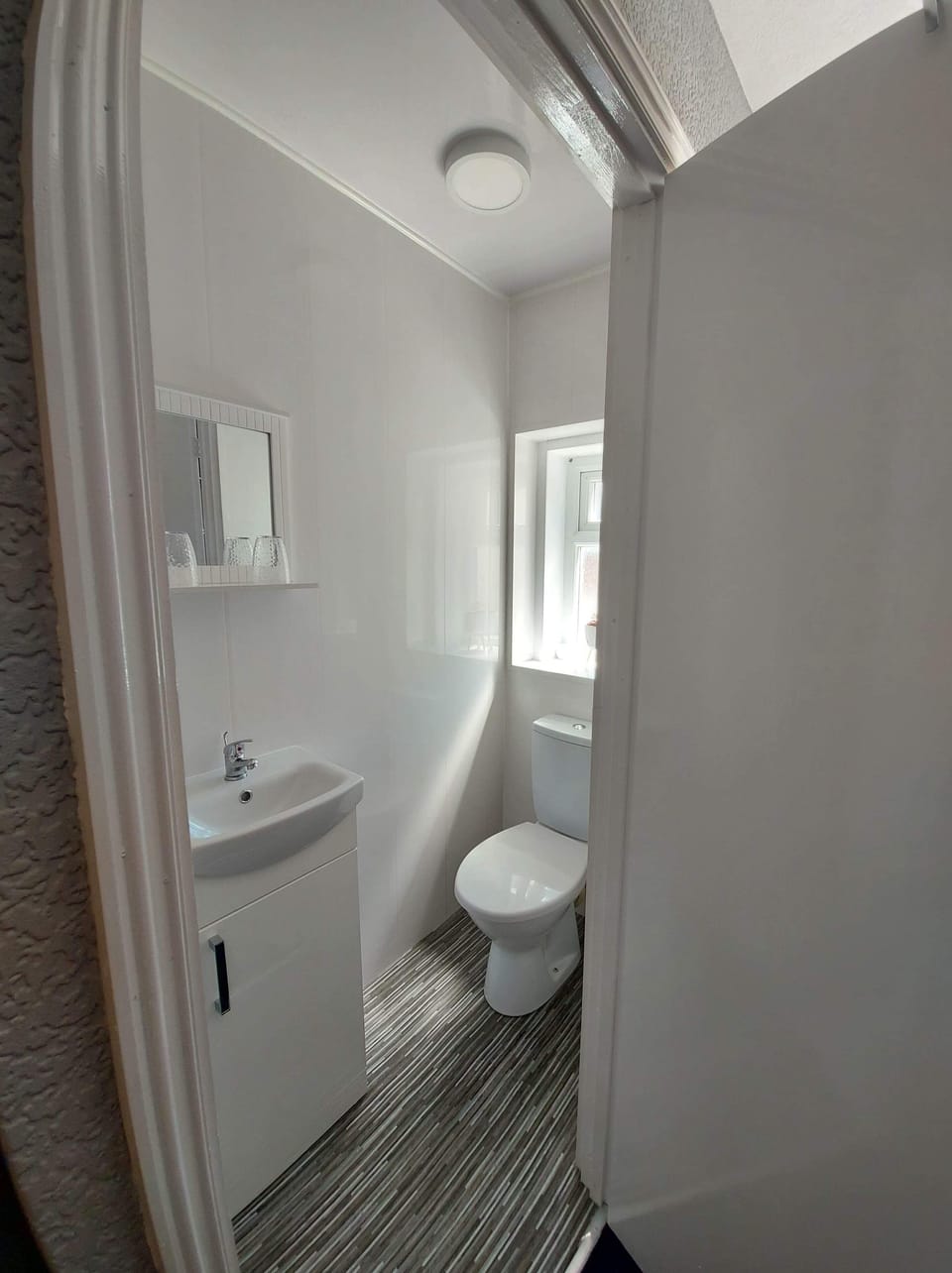 Shower, hair dryer, towels, toilet paper
