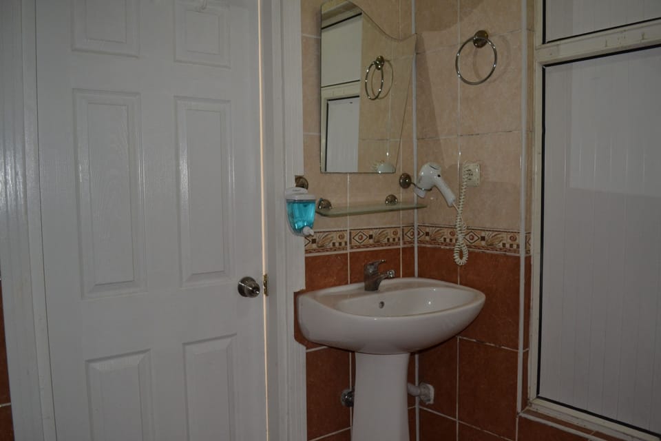Shower, free toiletries, hair dryer, slippers