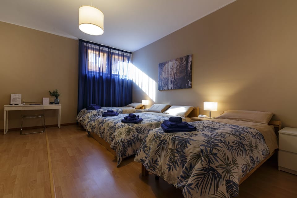 Quadruple Room | Minibar, in-room safe, desk, laptop workspace