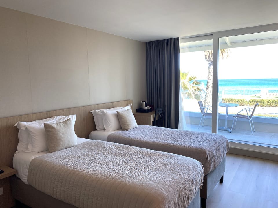 Twin Room, Balcony, Sea View | Minibar, in-room safe, desk, free WiFi