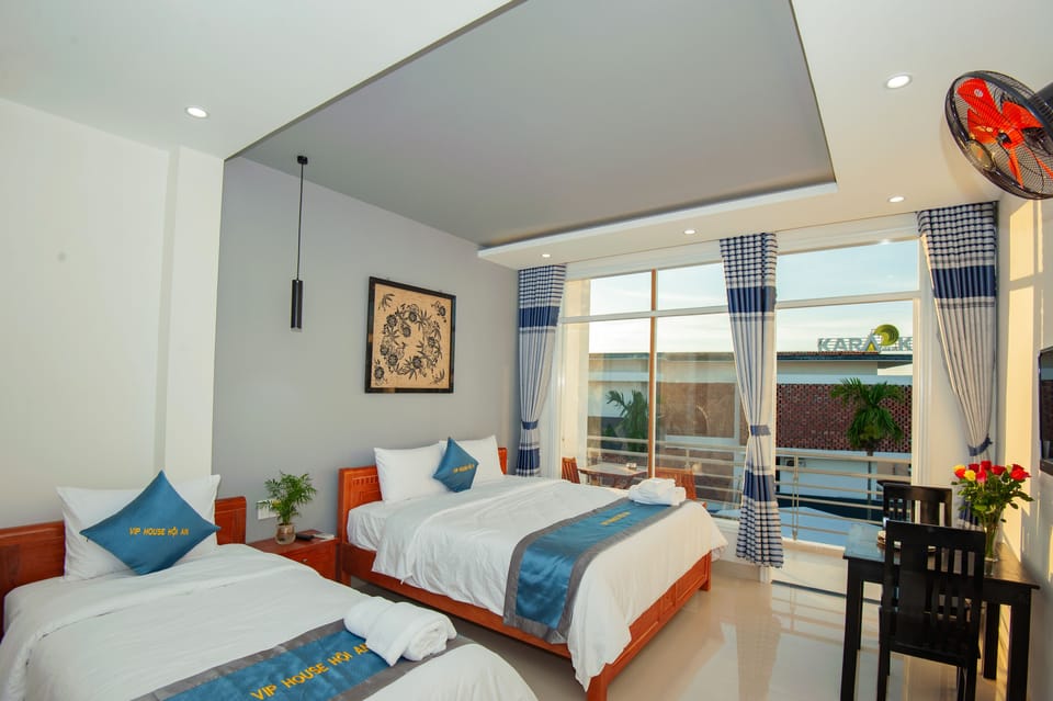 Deluxe Triple Room, Balcony | Minibar, in-room safe, desk, soundproofing
