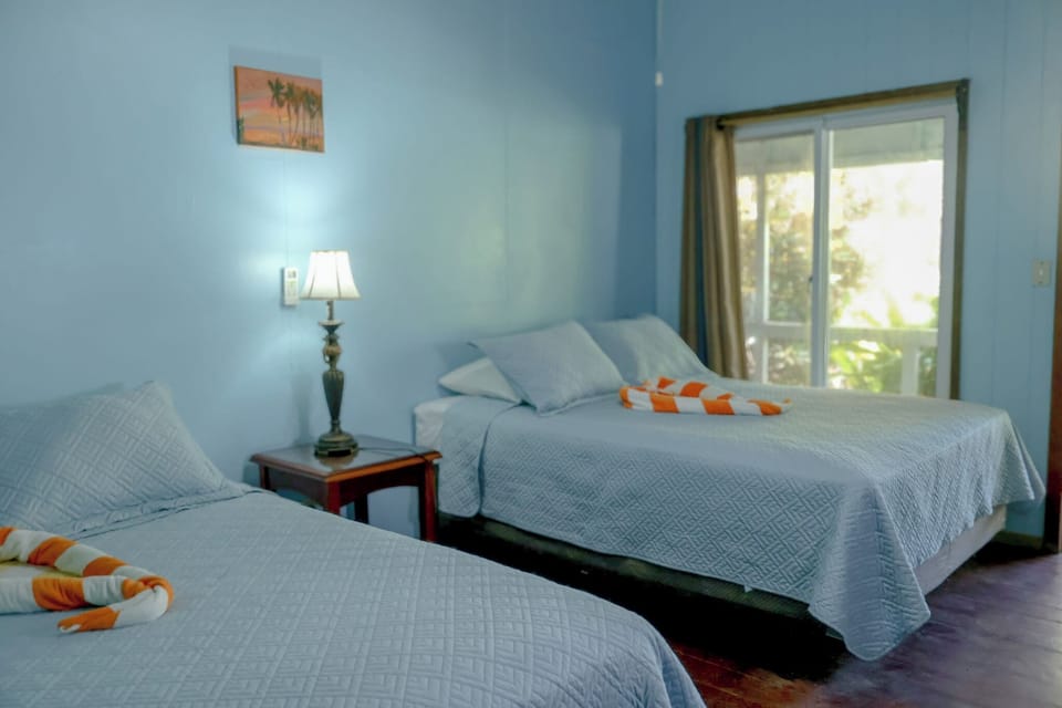 Basic Room, 2 Queen Beds, Sea View | Pillowtop beds, bed sheets