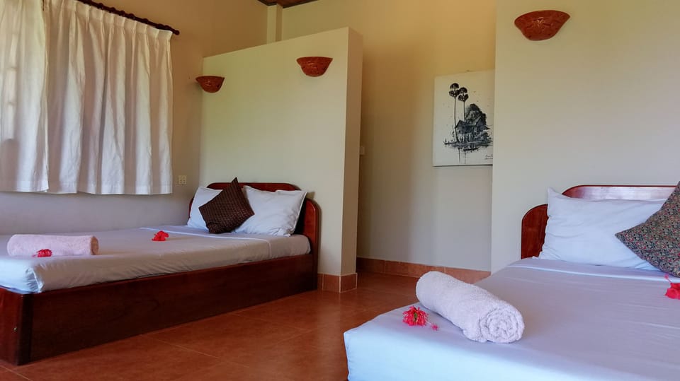 Deluxe Quadruple Room, 2 Double Beds, Garden View | 1 bedroom, individually furnished, desk, free WiFi
