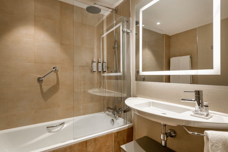 Rainfall showerhead, eco-friendly toiletries, hair dryer, towels