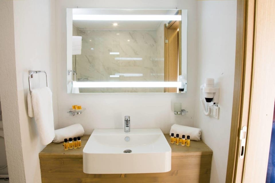 Shower, free toiletries, hair dryer, slippers