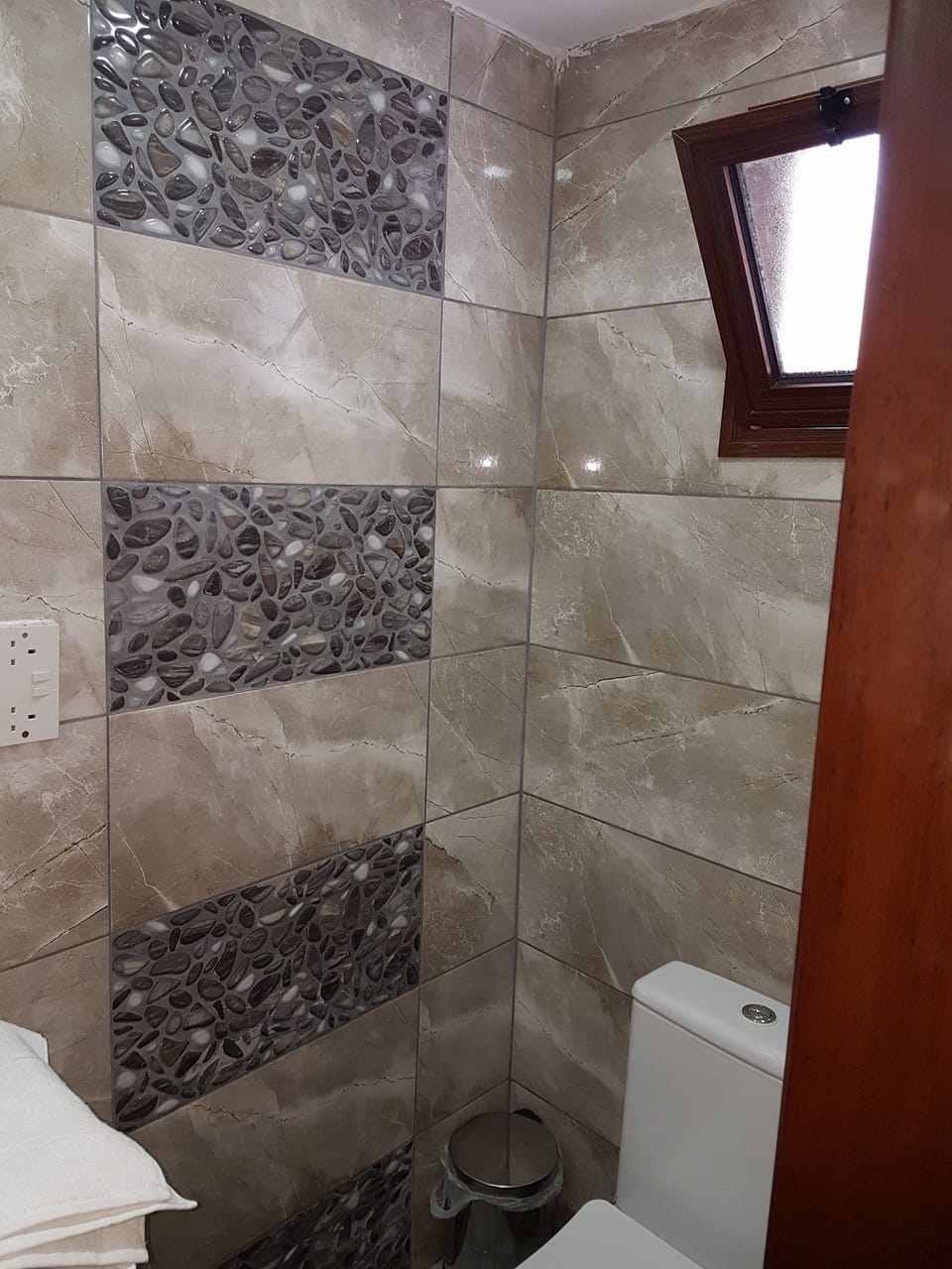 Shower, hair dryer, slippers, towels