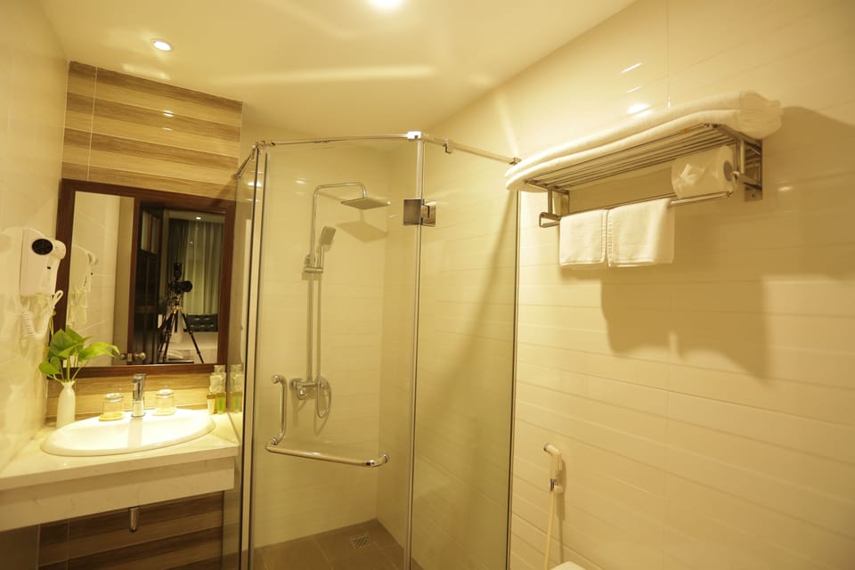 Shower, free toiletries, hair dryer, slippers