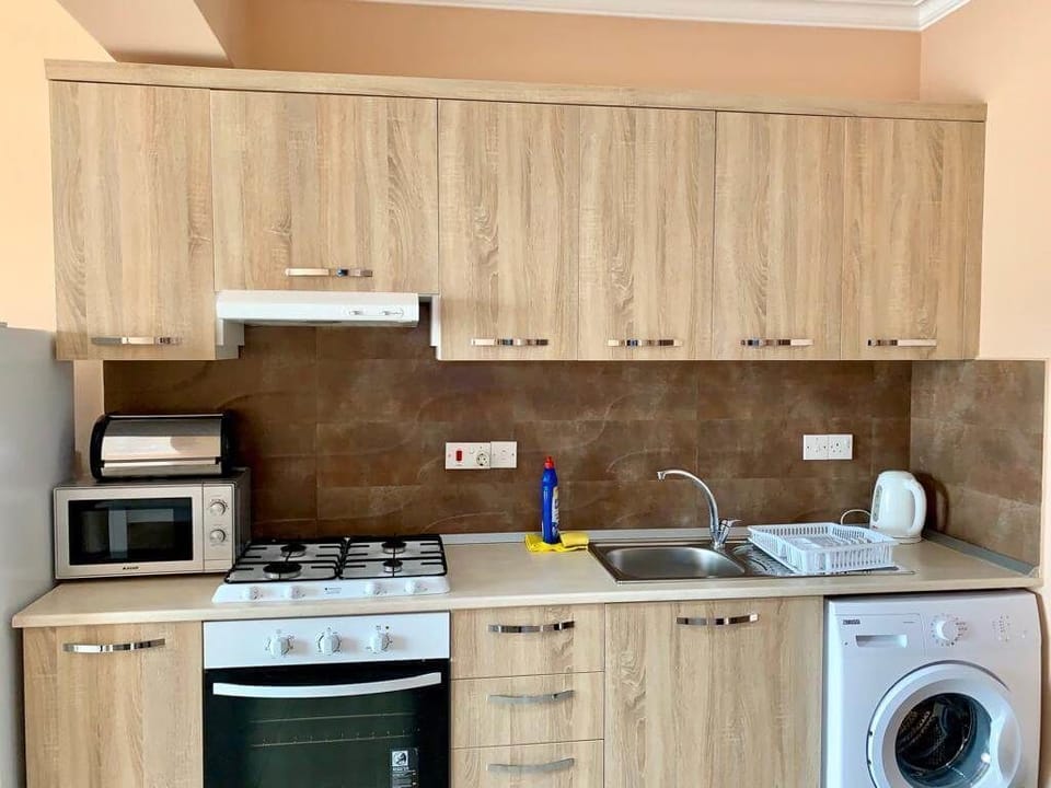 Apartment, Balcony, Sea View | Private kitchen | Coffee/tea maker, full-size fridge, microwave, oven