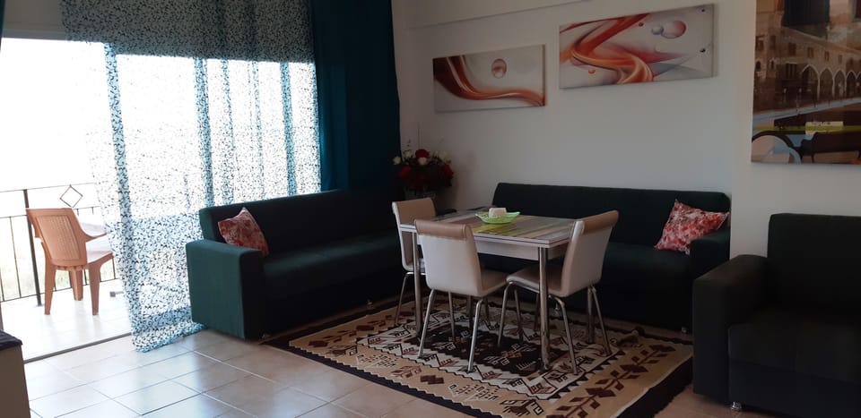 Comfort Apartment, 1 Bedroom, Balcony, Sea View | Living area | Flat-screen TV
