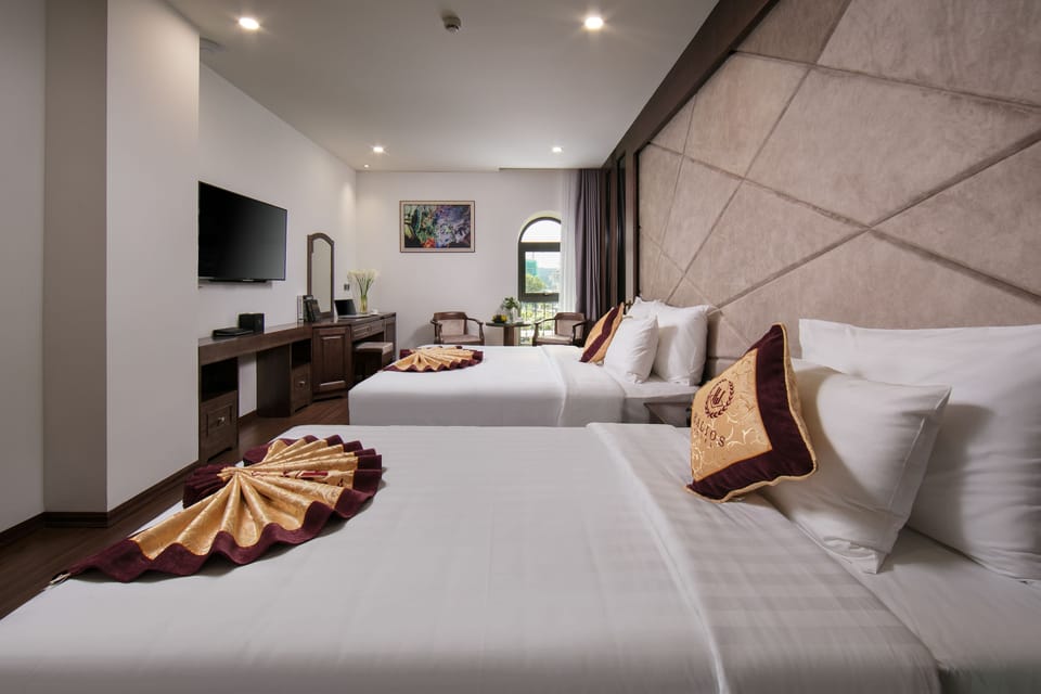 Junior Triple Room | Minibar, in-room safe, desk, laptop workspace