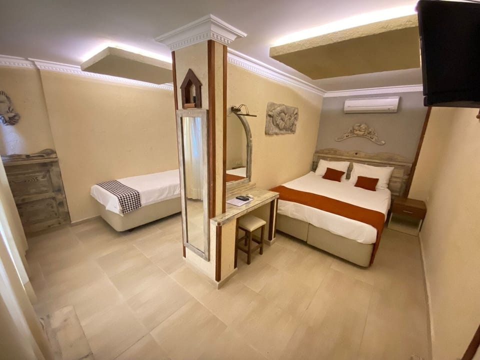 Family Room, Courtyard View | 1 bedroom, premium bedding, free minibar items, in-room safe
