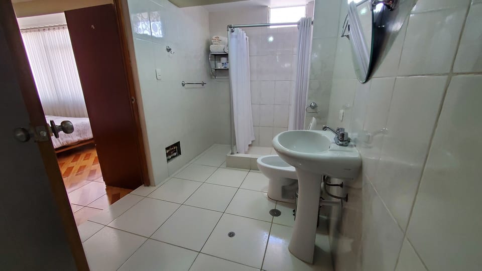 Family Quadruple Room | Bathroom | Bathtub, towels