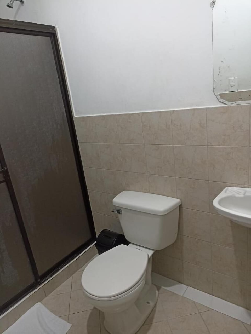 Shower, towels, soap, toilet paper