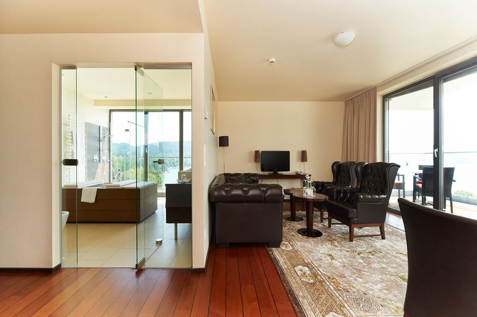 Deluxe Suite, 1 Bedroom, Balcony, Lake View | Living area | TV