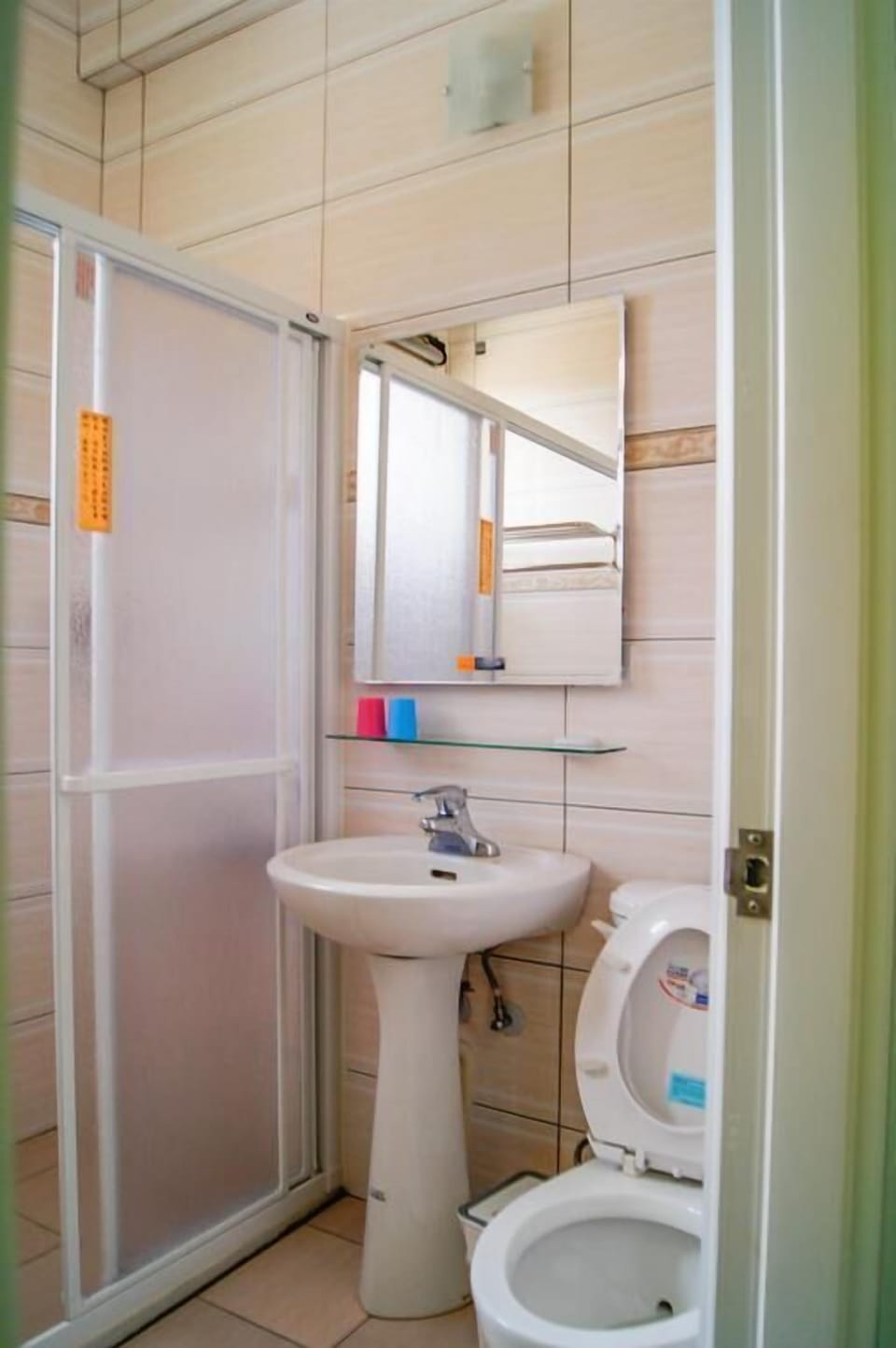 Shower, hair dryer, slippers, towels